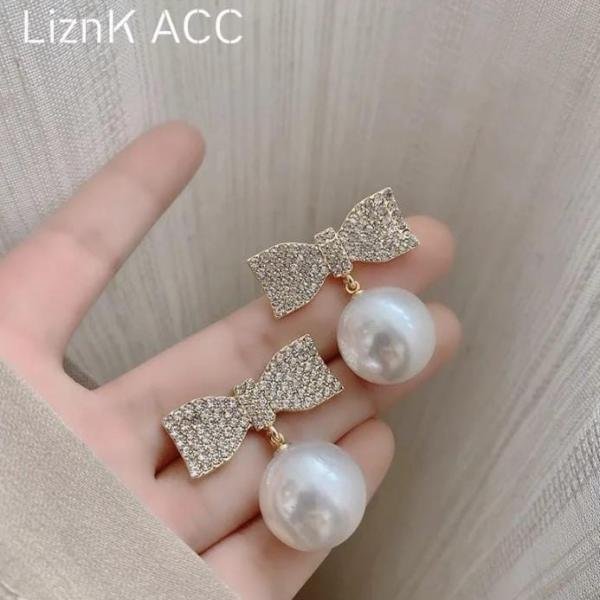 Bow And Pearl Earings