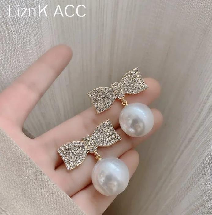 Bow And Pearl Earings